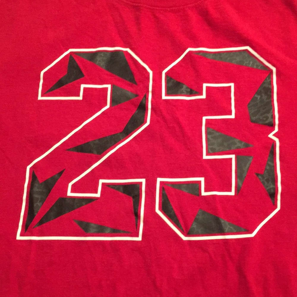 A vintage Michael Jordan #23 t-shirt red size large!